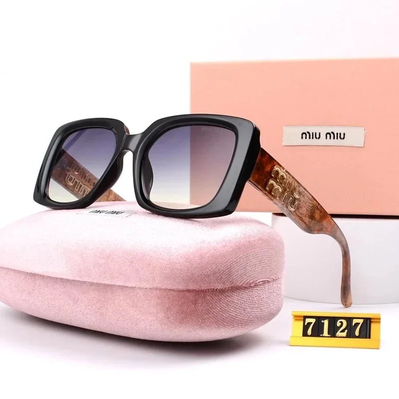 Miu Miu Gift Ready Oversized sunglasses Black Oval Sunglasses with Standout Detail