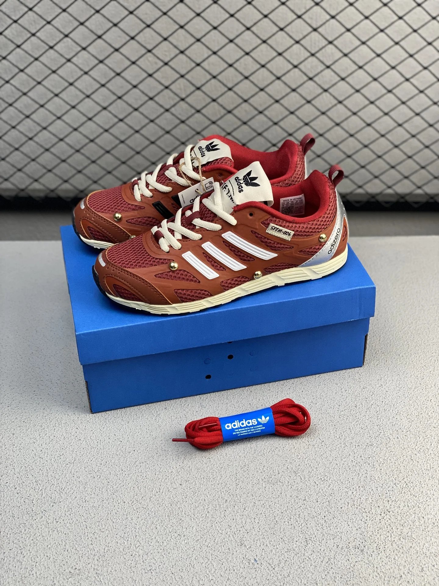 Adidas Chunky Runners with Raised Heel Cushioning in Rust Brown