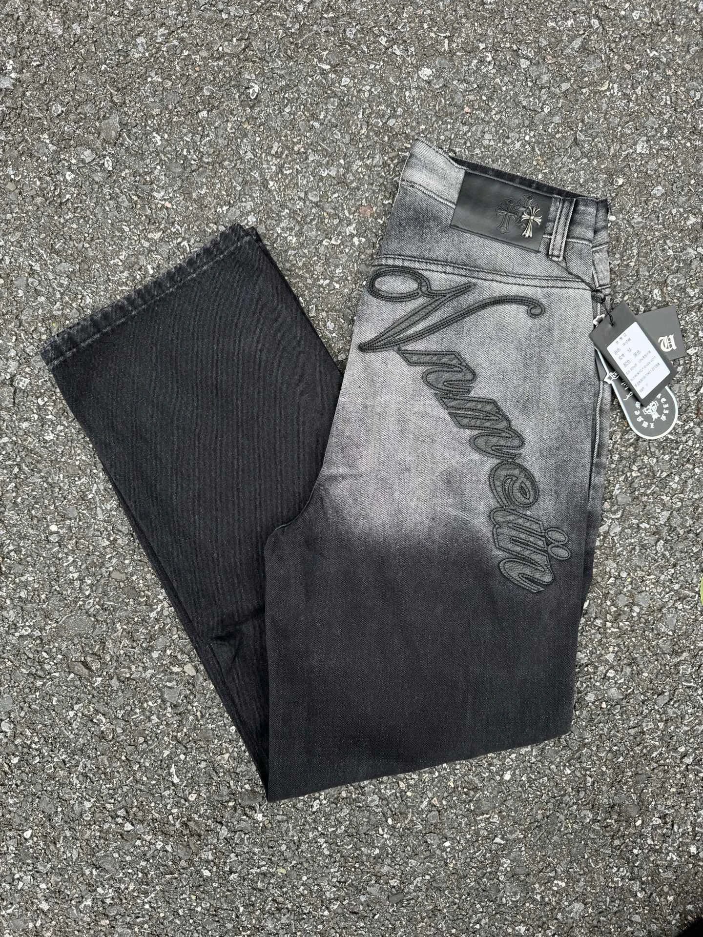 Large Script Branding And A Contrast Fade Gray Wash Moncler Logo Jeans