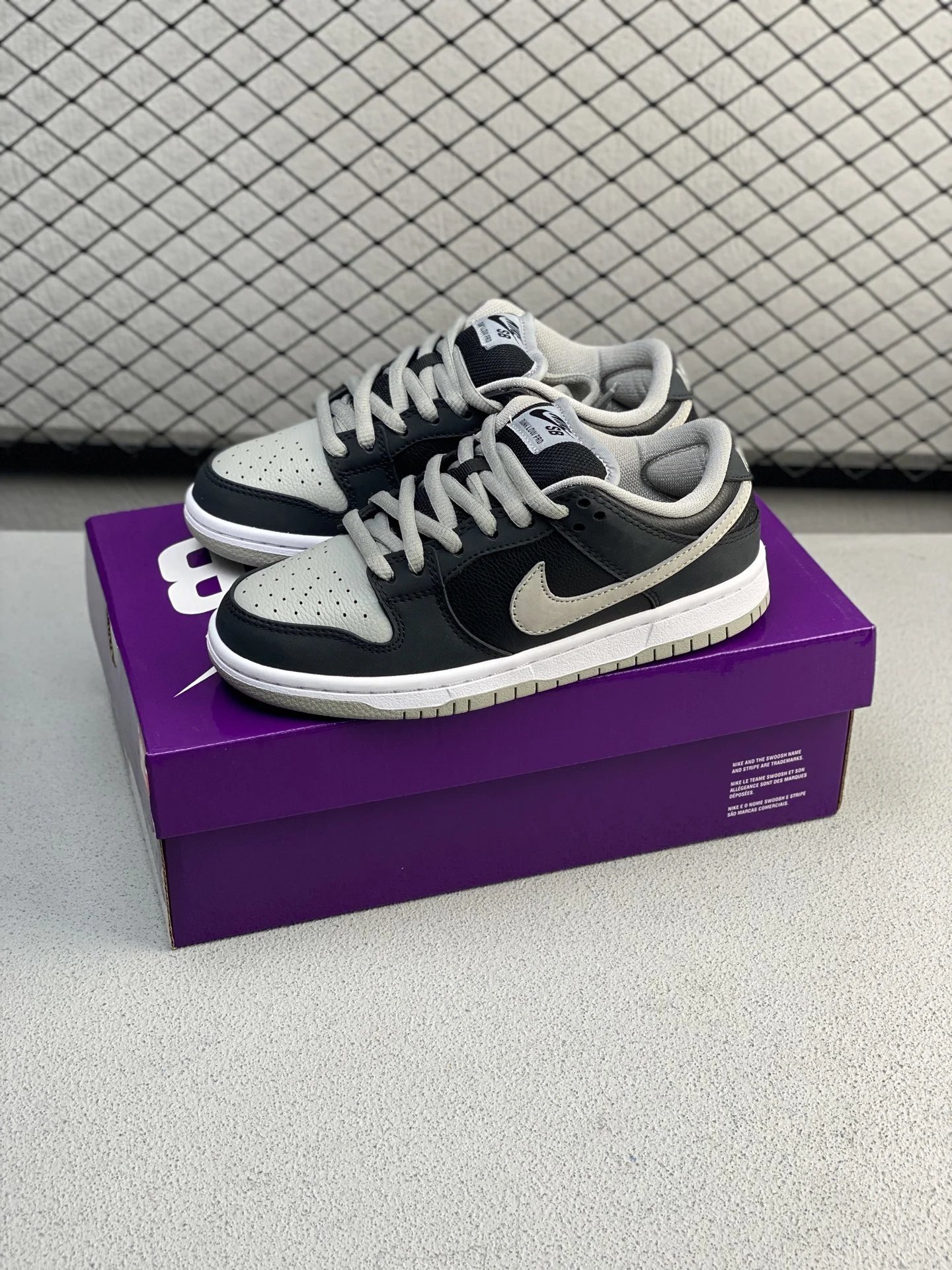 Nike Black and White Low-Top Sneakers with Padded Heel Collar