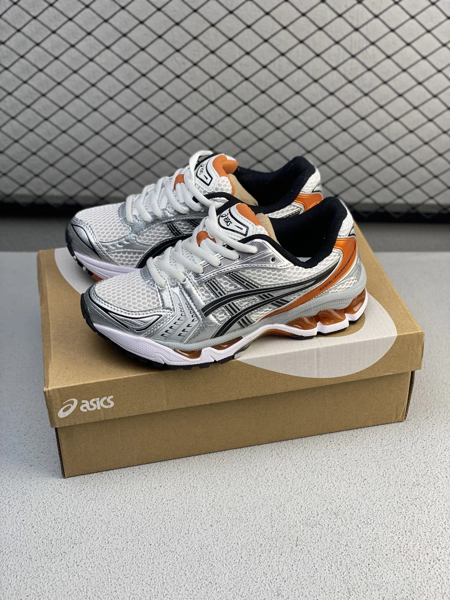 Asics Running Shoes with Layered Mesh Upper in White, Silver and Orange