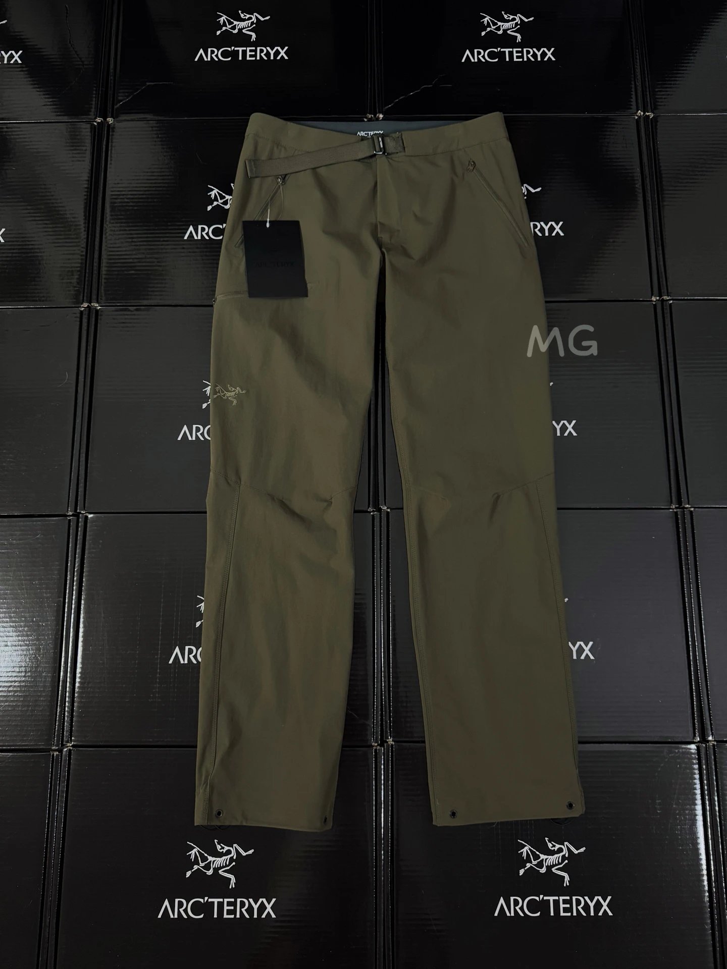Arc'teryx Olive Technical Straight Pants with clean outdoor profile and subtle performance logo