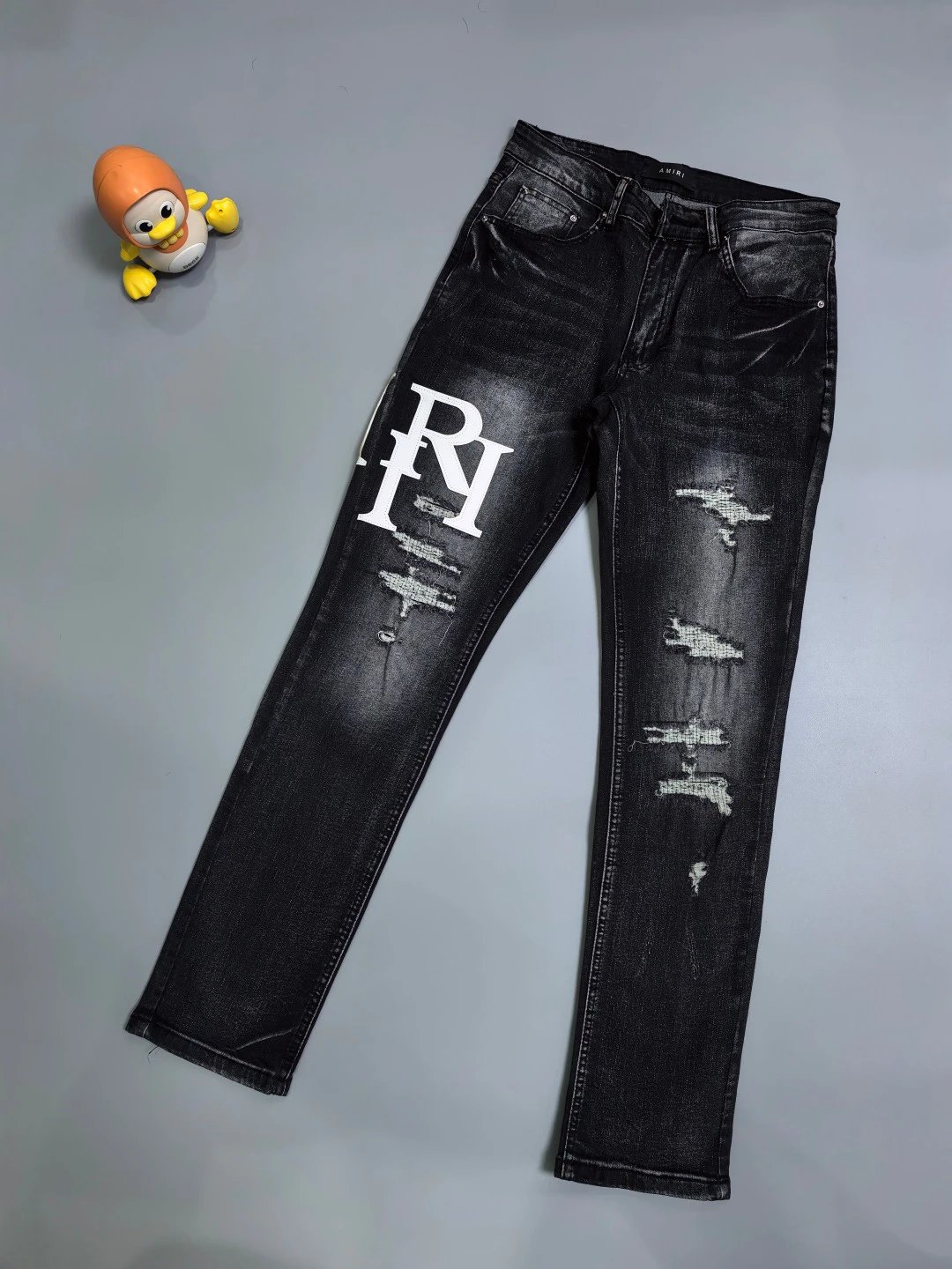 Represent Weekend Distressed Logo Jeans - large white monogram and ripped slim-leg detailing