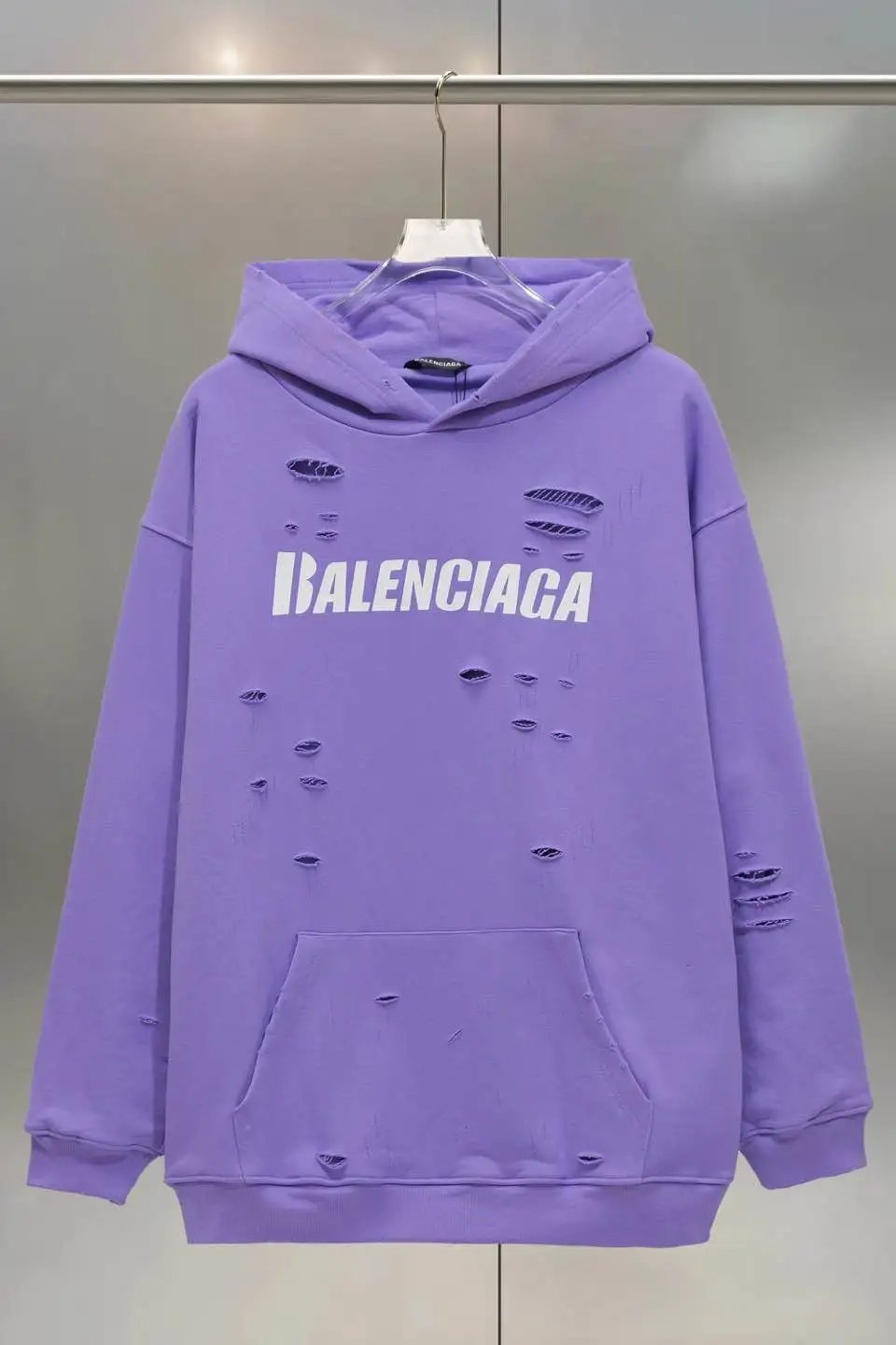 Balenciaga's ripped purple sweatshirt