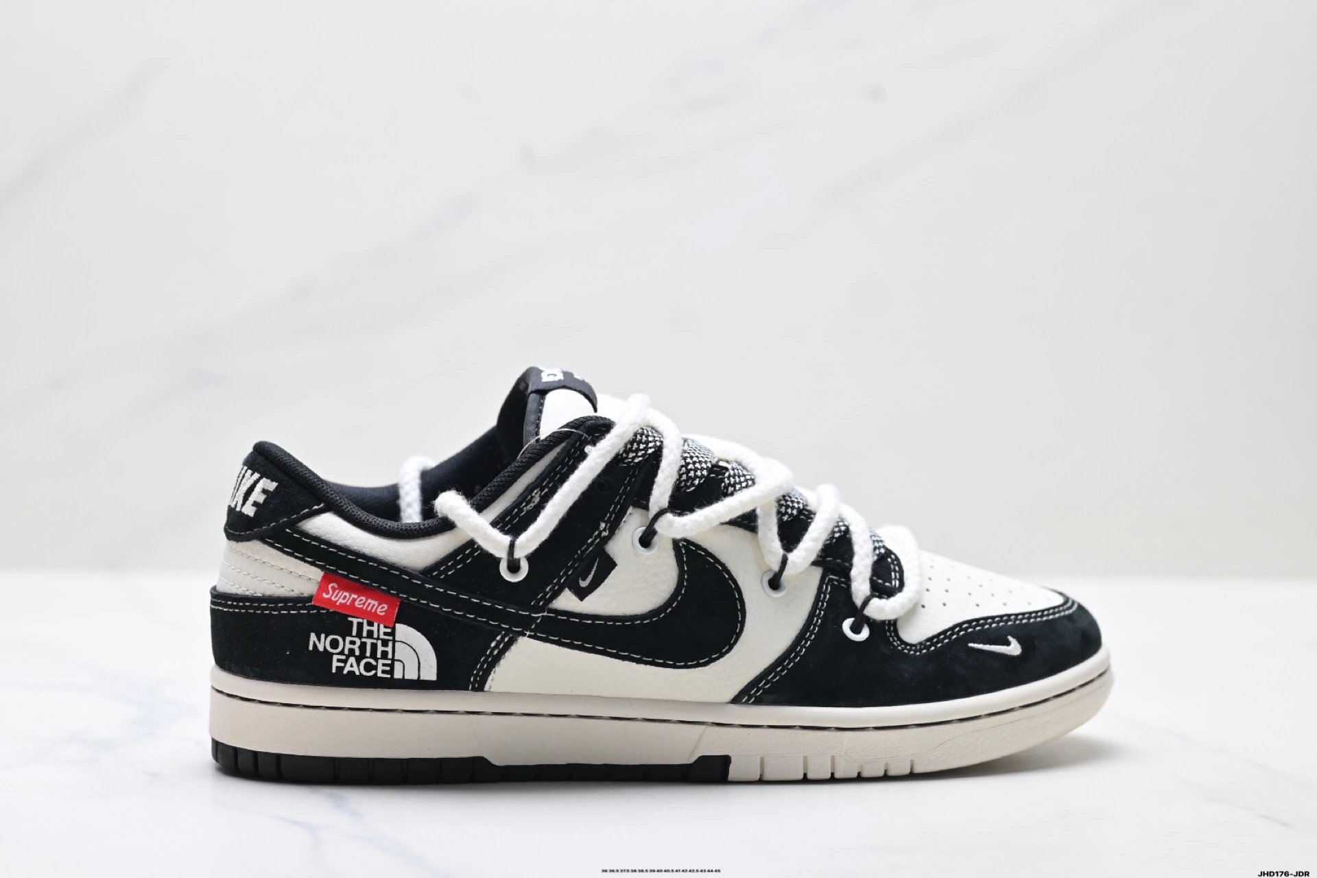Nike co-branded black and white sports shoes