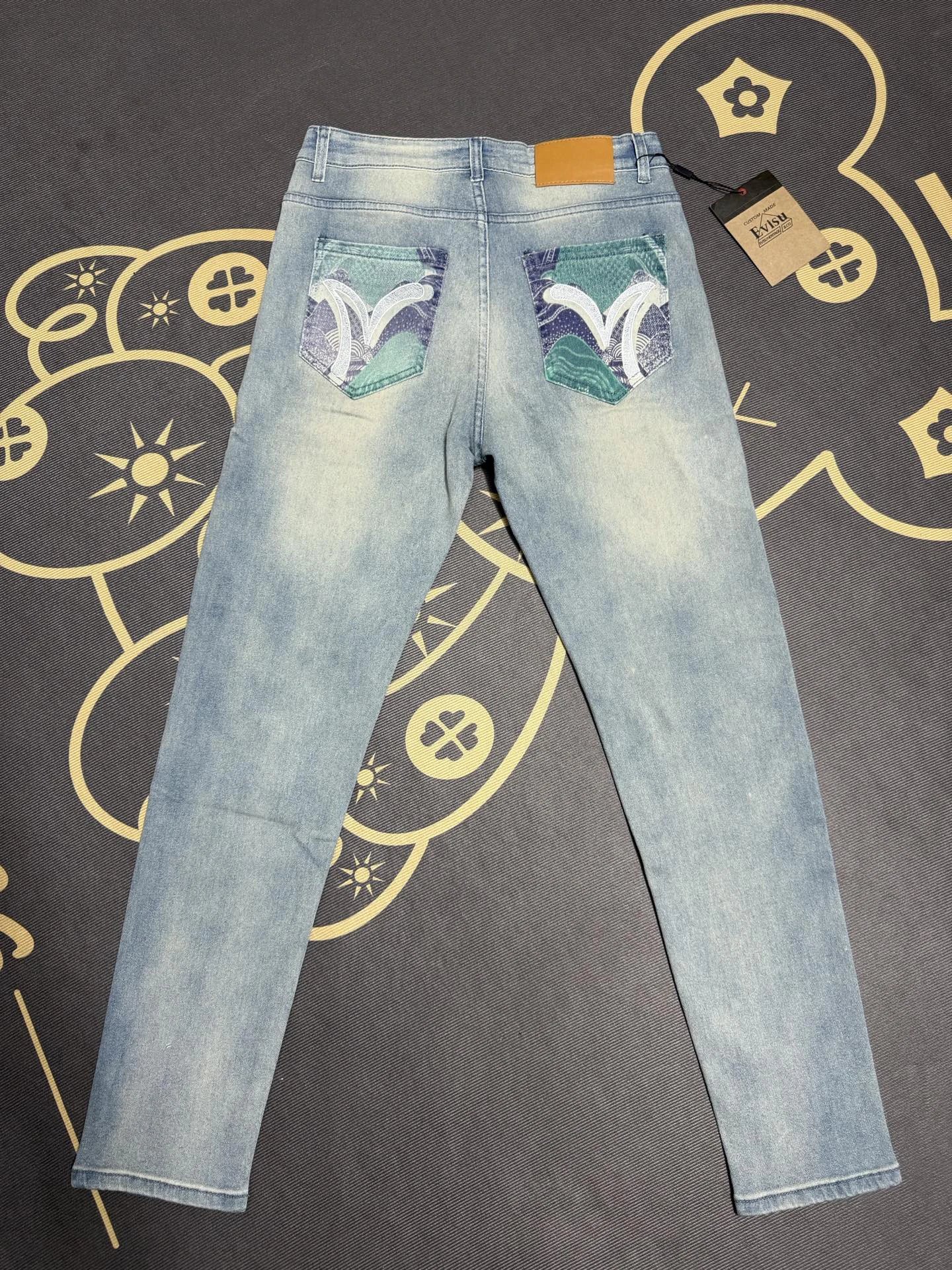 Travel Light Blue Evisu Graphic Jeans