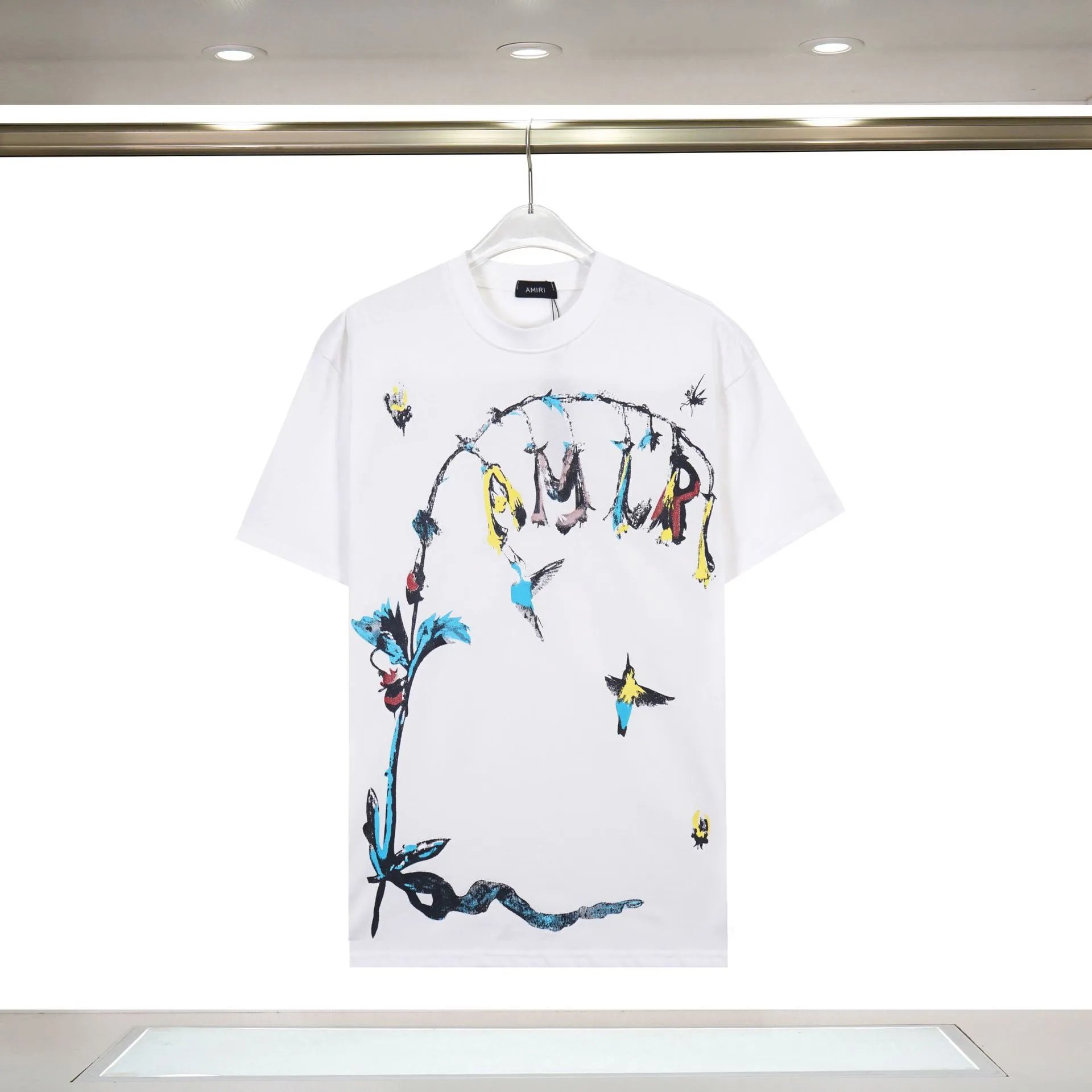 Amiri Streetwear Graphic T-shirt White Blue Amiri with Logo Accent