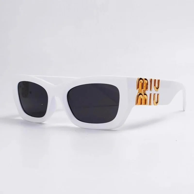 Miu Miu Monogram Oversized sunglasses Black Oval Sunglasses for Layered Styling