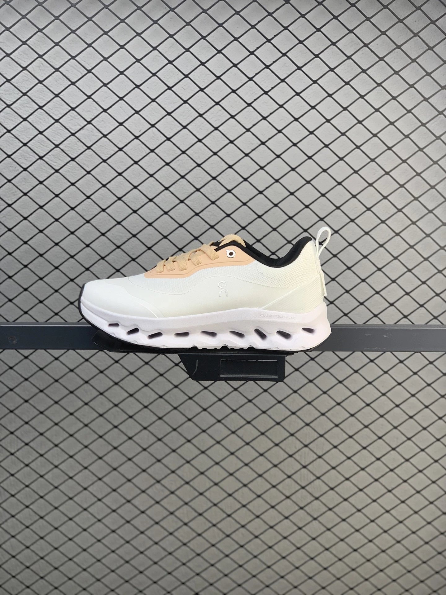 On White and Peach Cloud Runners, Segmented Sole Pods
