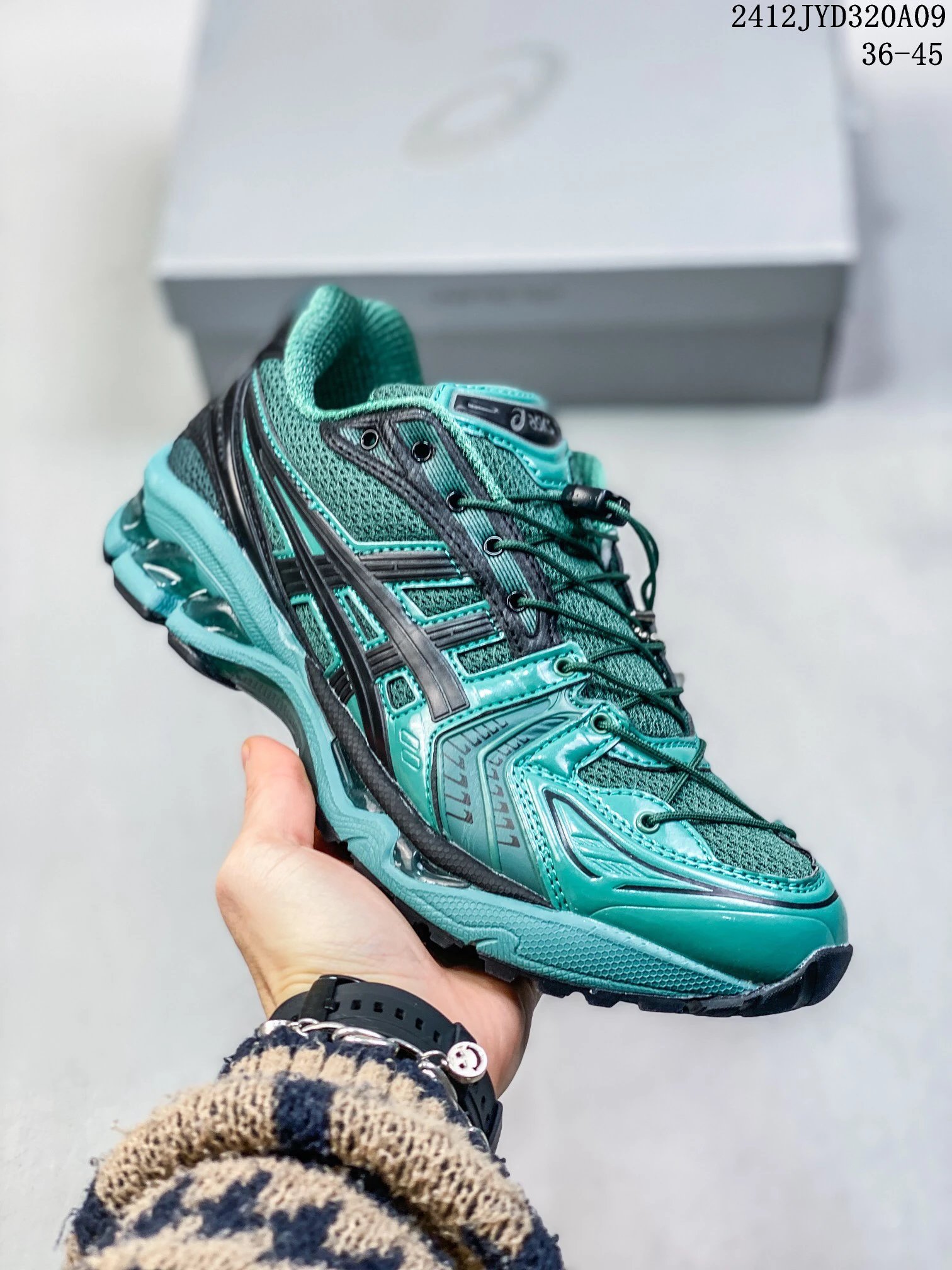 ASICS retro-style dark green sports shoes