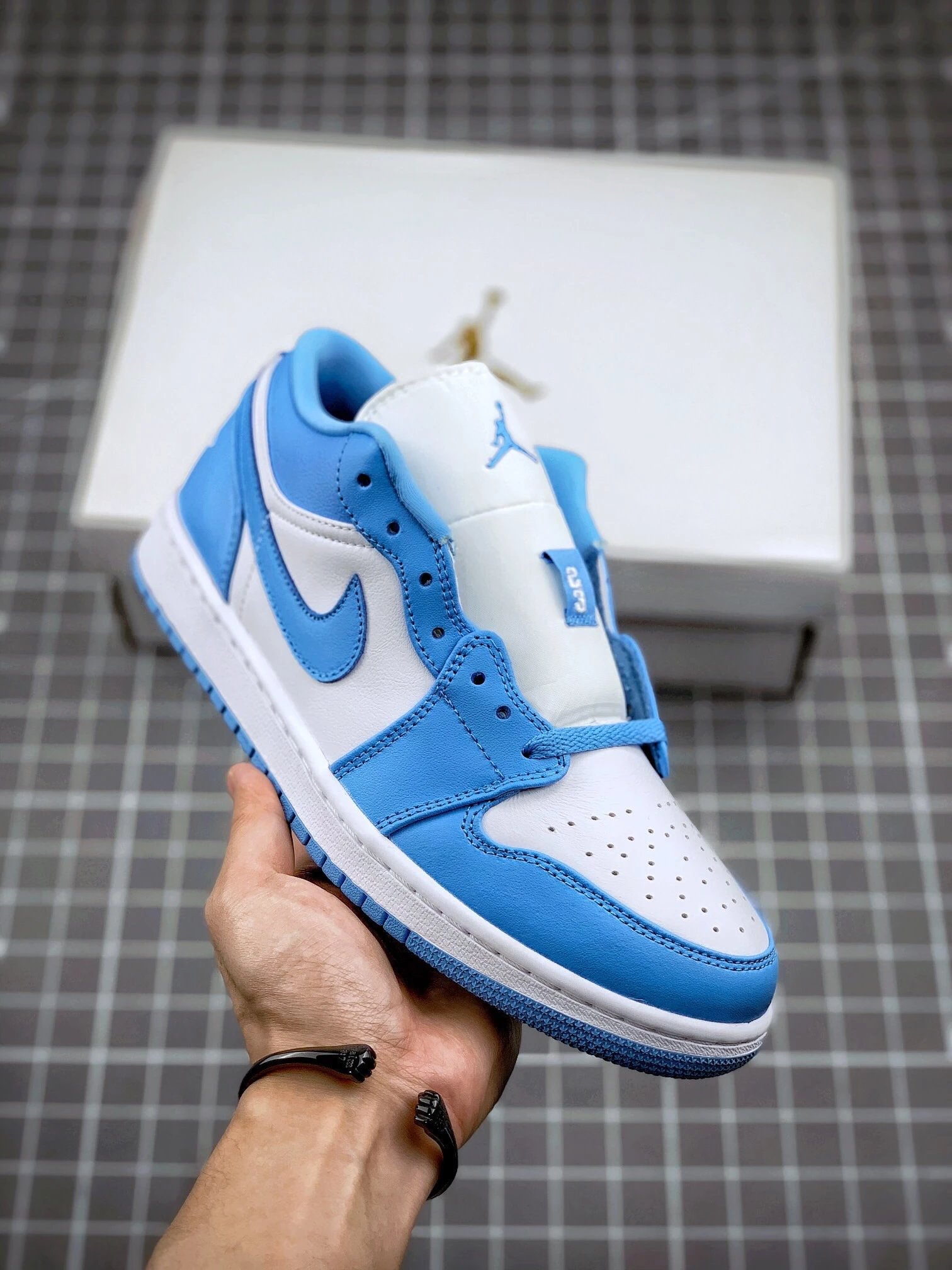 Jordan Blue and White Low-Top Sneakers Featuring Rounded Toe