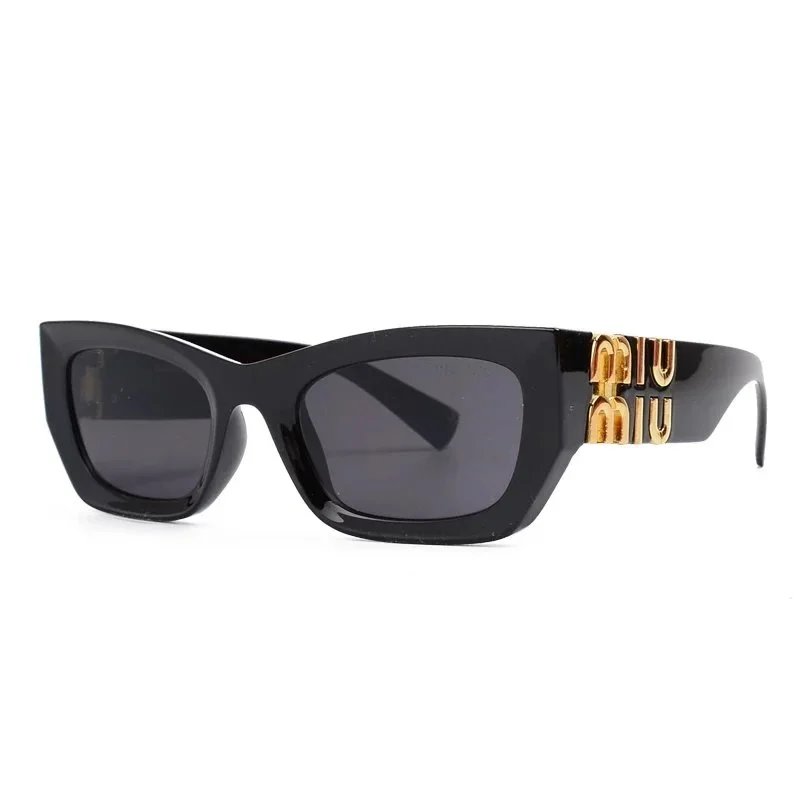 Miu Miu Urban Oversized sunglasses Black Oval Sunglasses with Statement Pattern