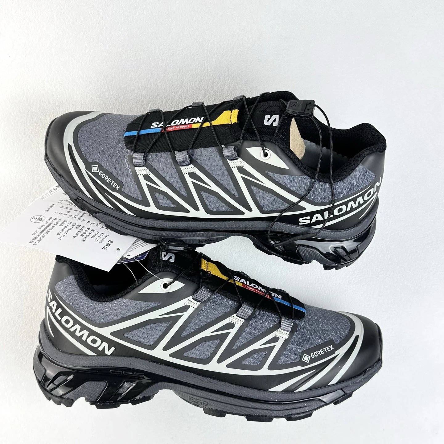 Salomon Black and Gray Trail Sneakers Defined by Treaded Trail Sole