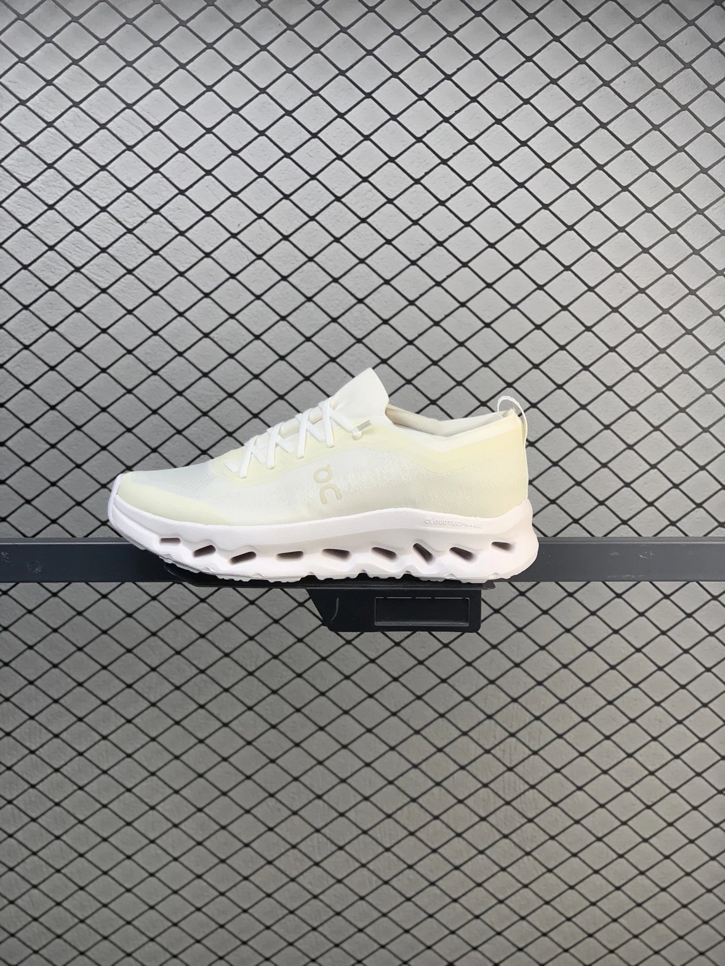 On White and Yellow Cloud Runners Defined by Open Mesh Panels