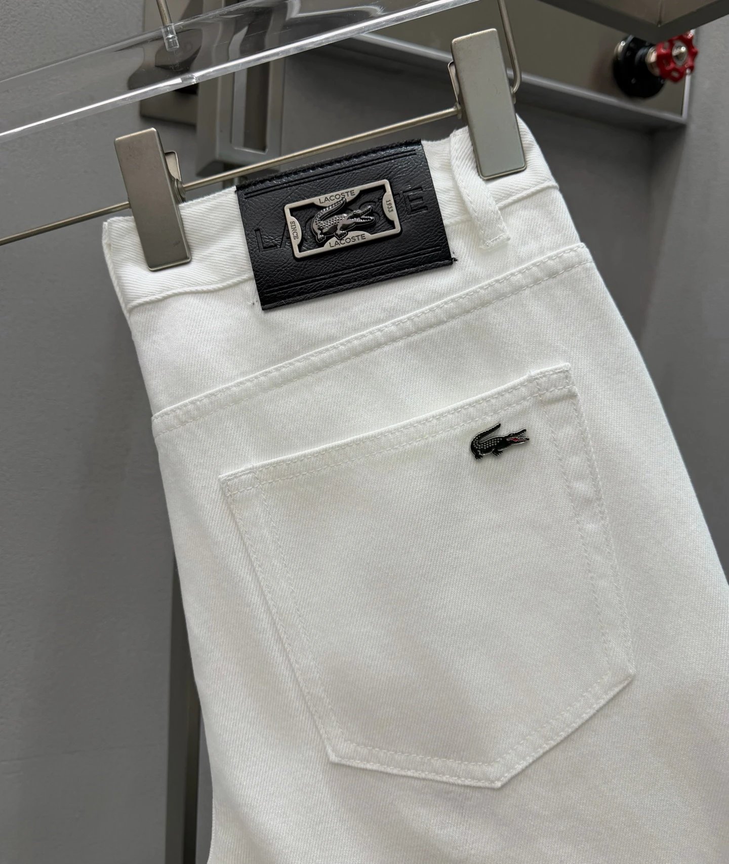 Logo Jeans with green crocodile emblem and clean back pocket - Lacoste Weekend Edit