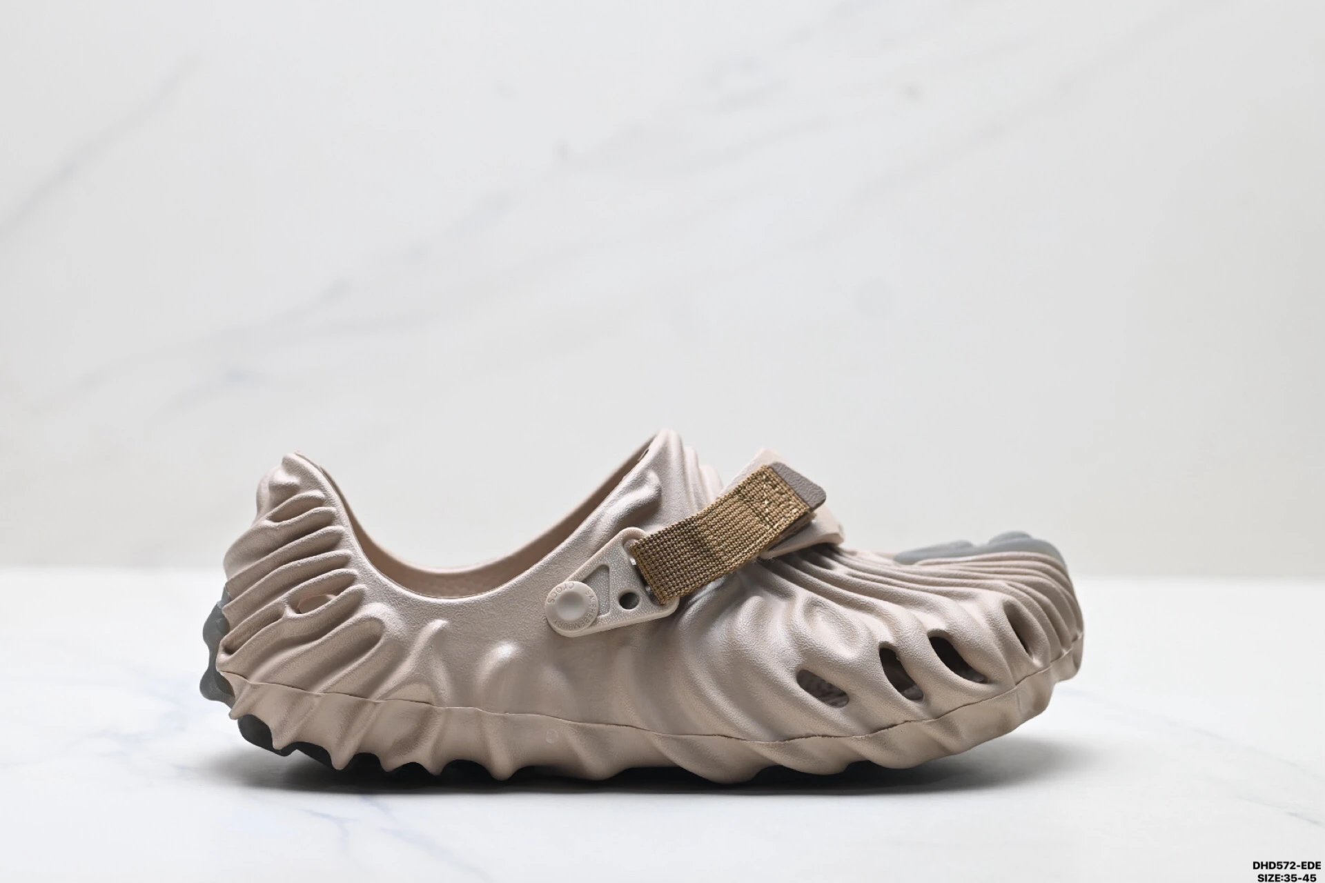 Fashionable beige Crocs clogs