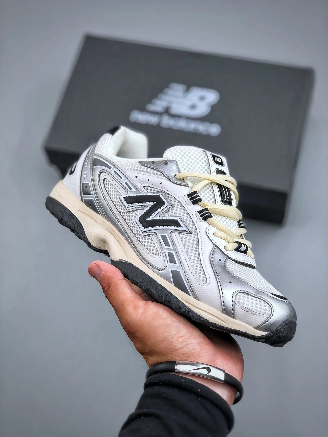 New Balance White and Silver Running Shoes Featuring Classic Running Profile