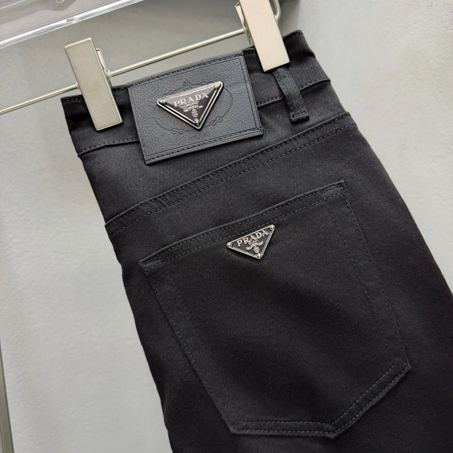 Triangle Hardware And A Structured Dark Denim Finish Prada Logo Jeans in Black