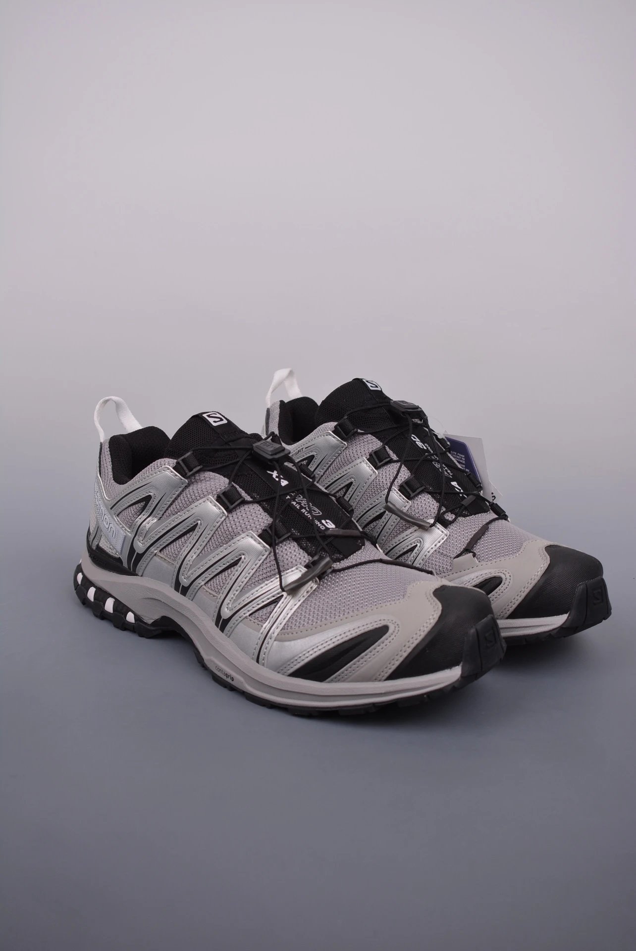 Salomon Gray and Black Trail Runners Highlighting Treaded Trail Sole