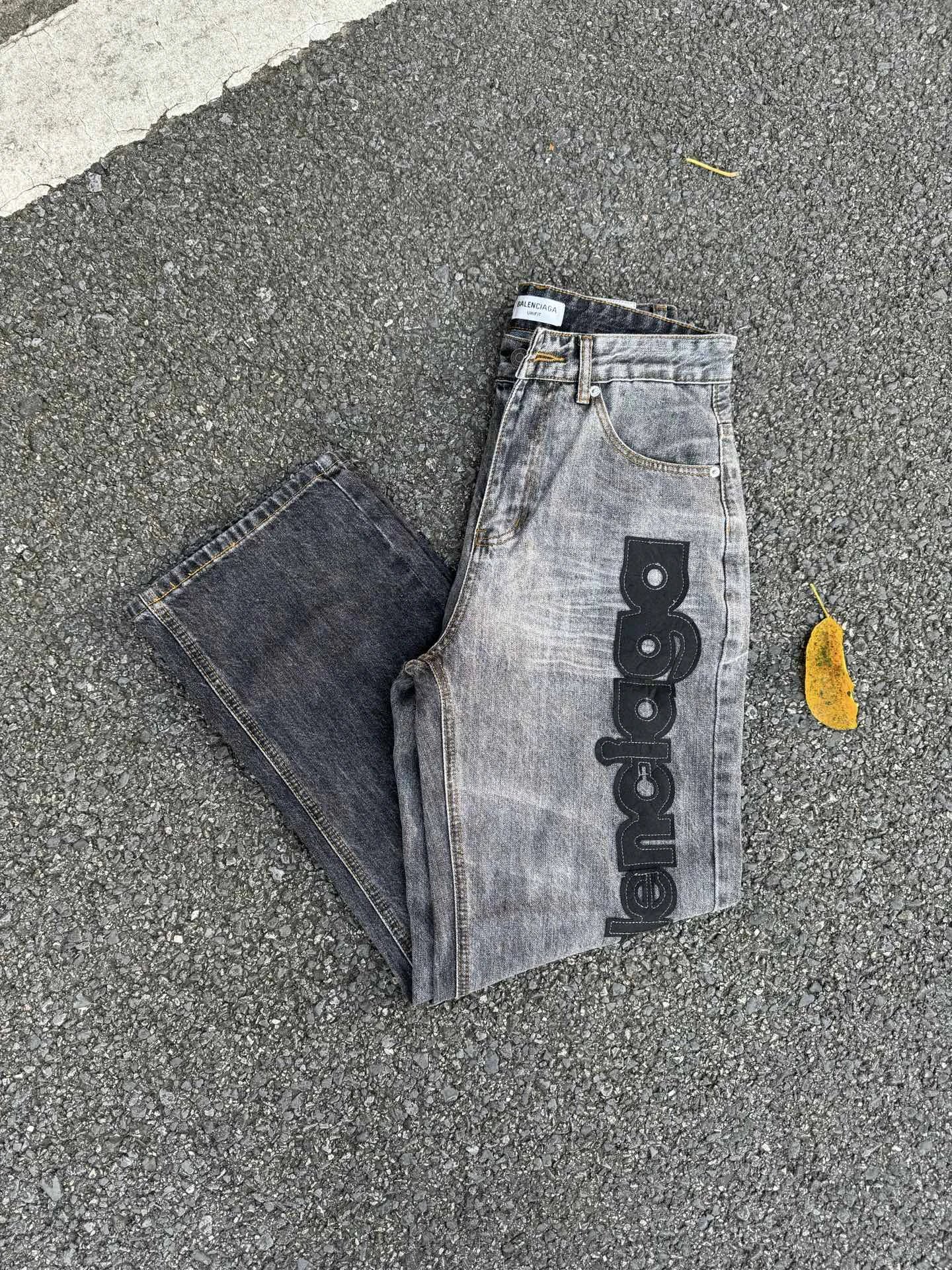 Balenciaga Logo Jeans with large side script branding and a faded leg in Gray Wash