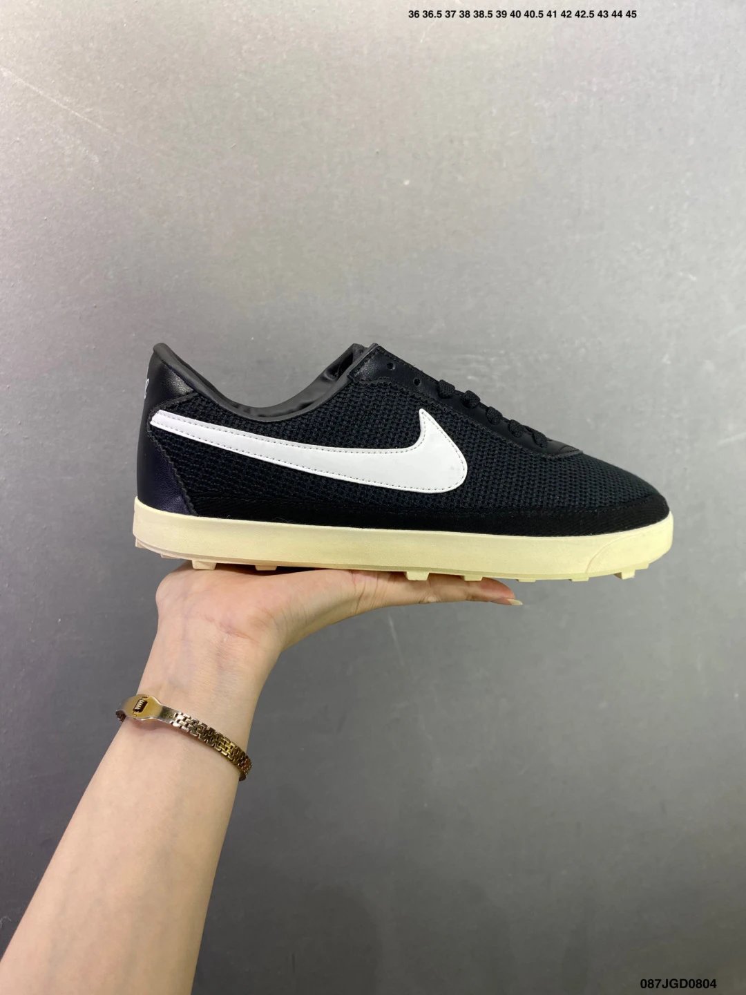 Nike Black and White Waffle-Sole Runners Highlighting Retro Heel Shape