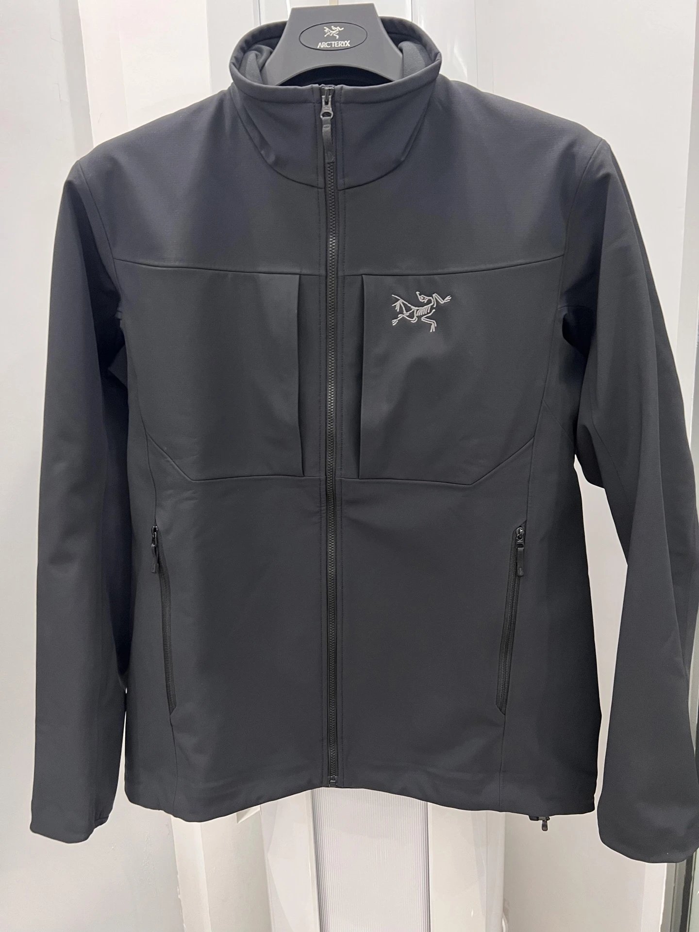 Arc’teryx black outdoor-style jacket