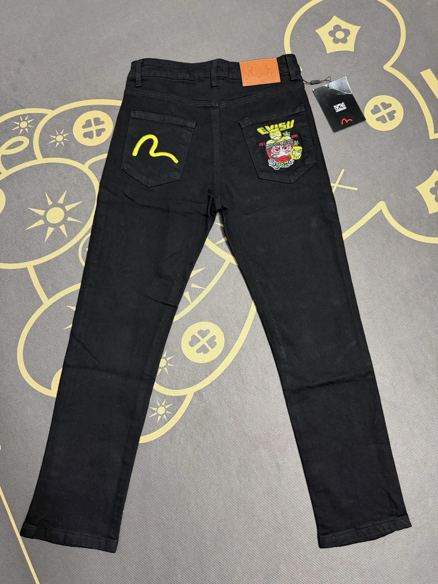 Evisu Bright Embroidered Character Patches And Slim Legs Graphic Jeans for weekend