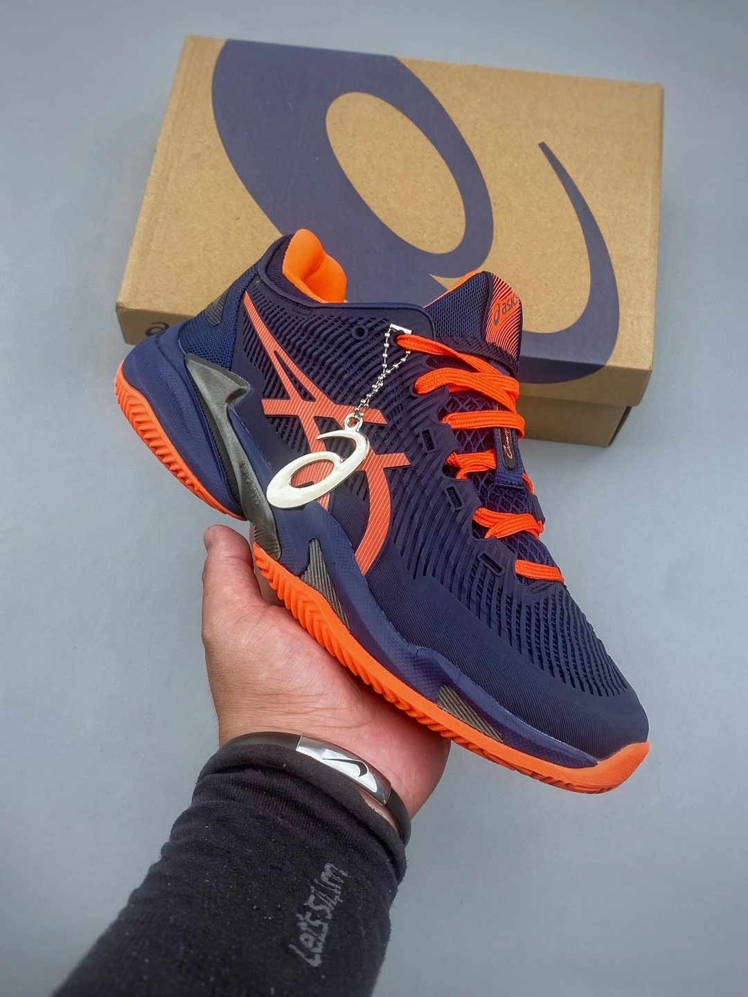 Asics Navy and Orange Running Shoes with Raised Heel Cushioning