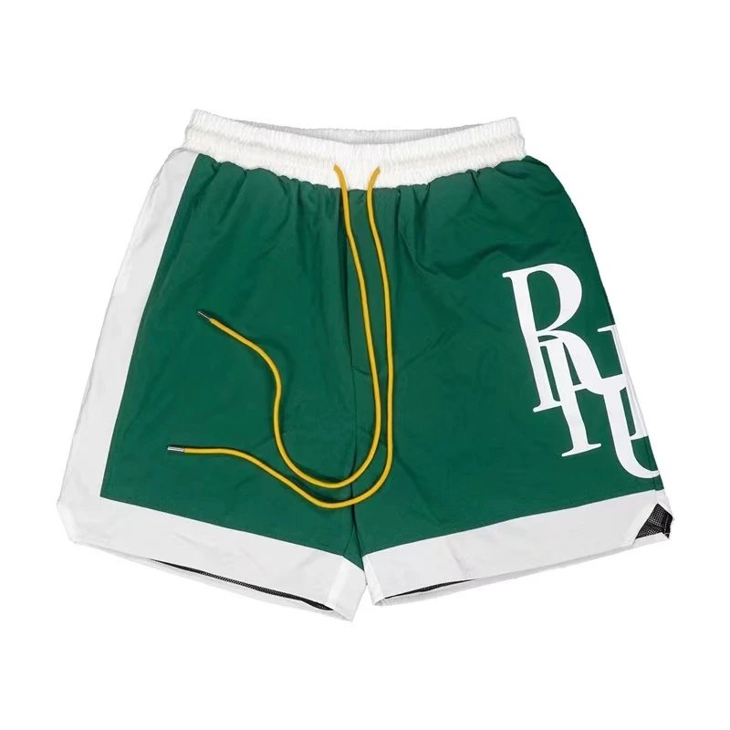 RHUDE sporty green and white shorts
