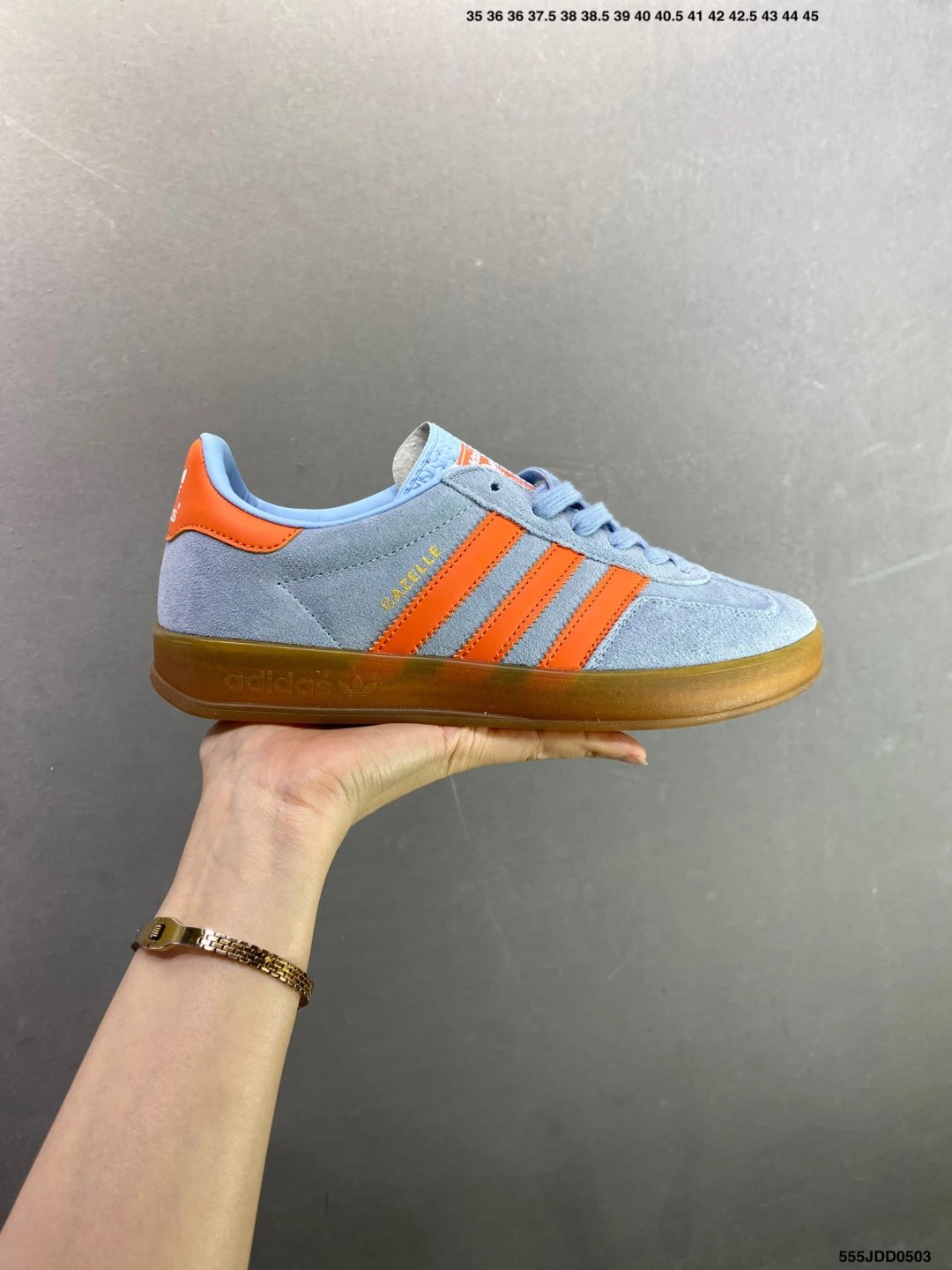 Adidas Light Blue and Orange Low-Profile Sneakers Highlighting Rounded Toe