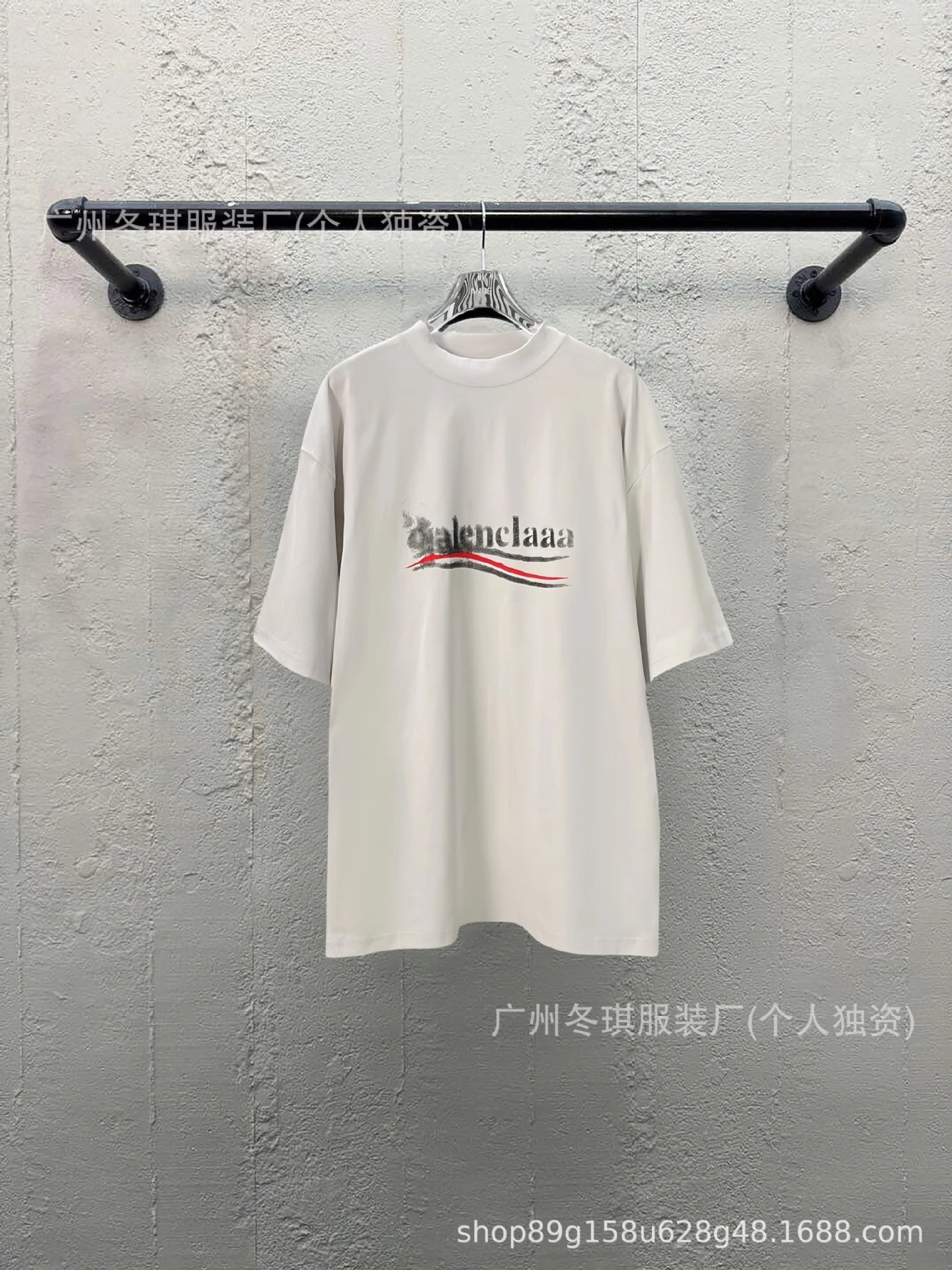 Balenciaga alphabet-style white T-shirt.