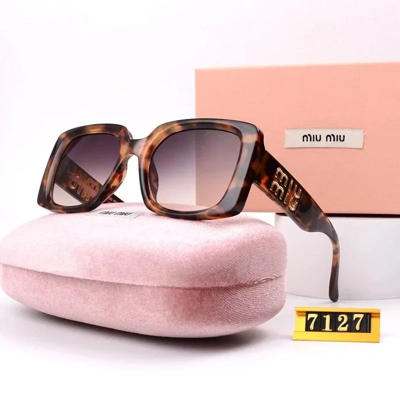 Miu Miu Relaxed Oversized sunglasses Black Oval Sunglasses with Designer-Inspired Detail