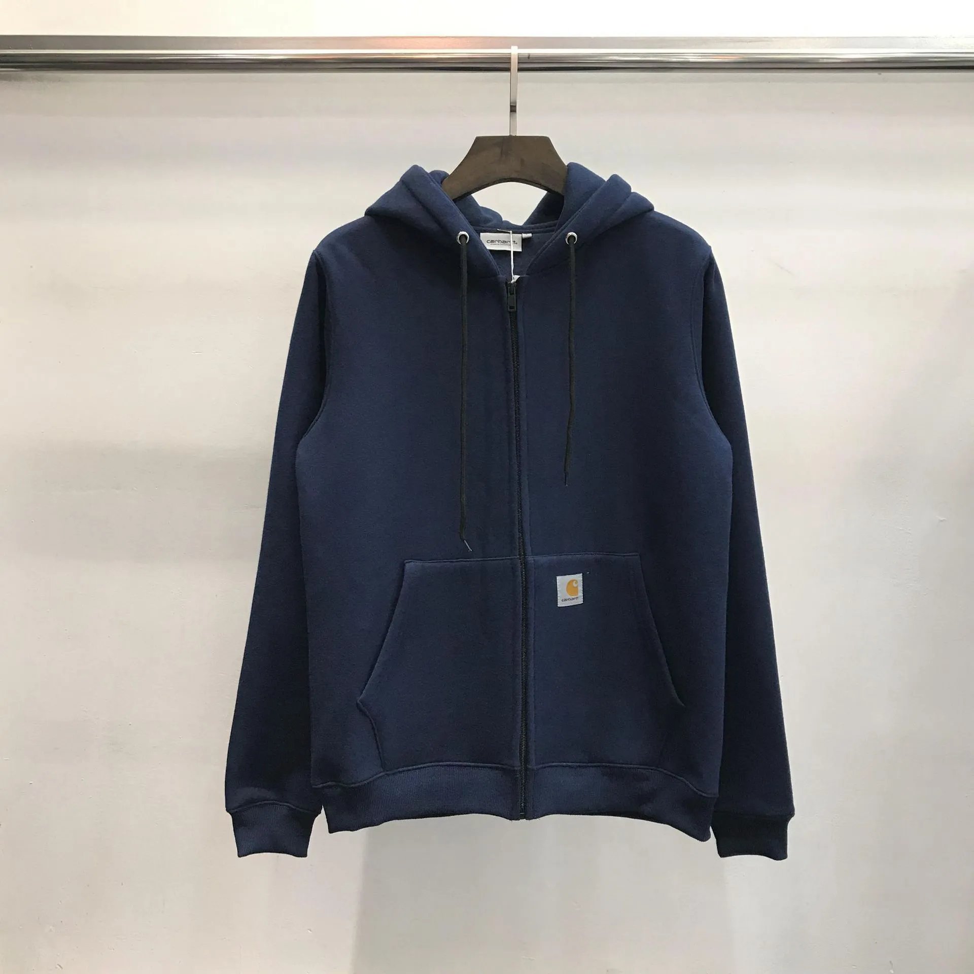 Carhartt Logo Patch Zip Hoodie Combining Navy Blue Color with a full zip and split pouch pockets
