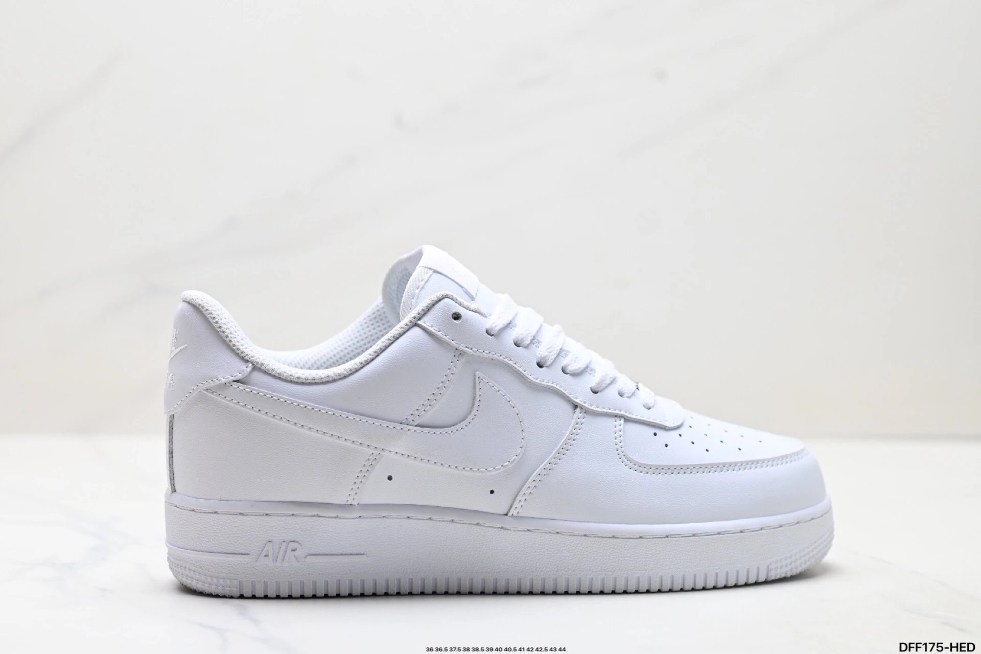 Nike Air Force 1 white sneakers.