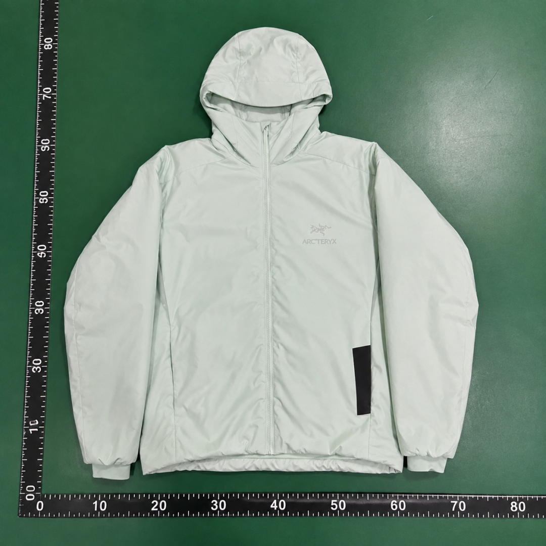 Clean Hooded Profile And Minimal Chest Branding Arc'teryx Lightweight Shell Jacket in Mint Green QC photo