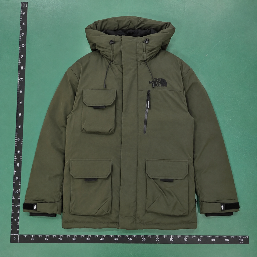 The North Face Utility Hooded Parka with oversized flap pockets and a structured outdoor silhouette - Layering QC photo