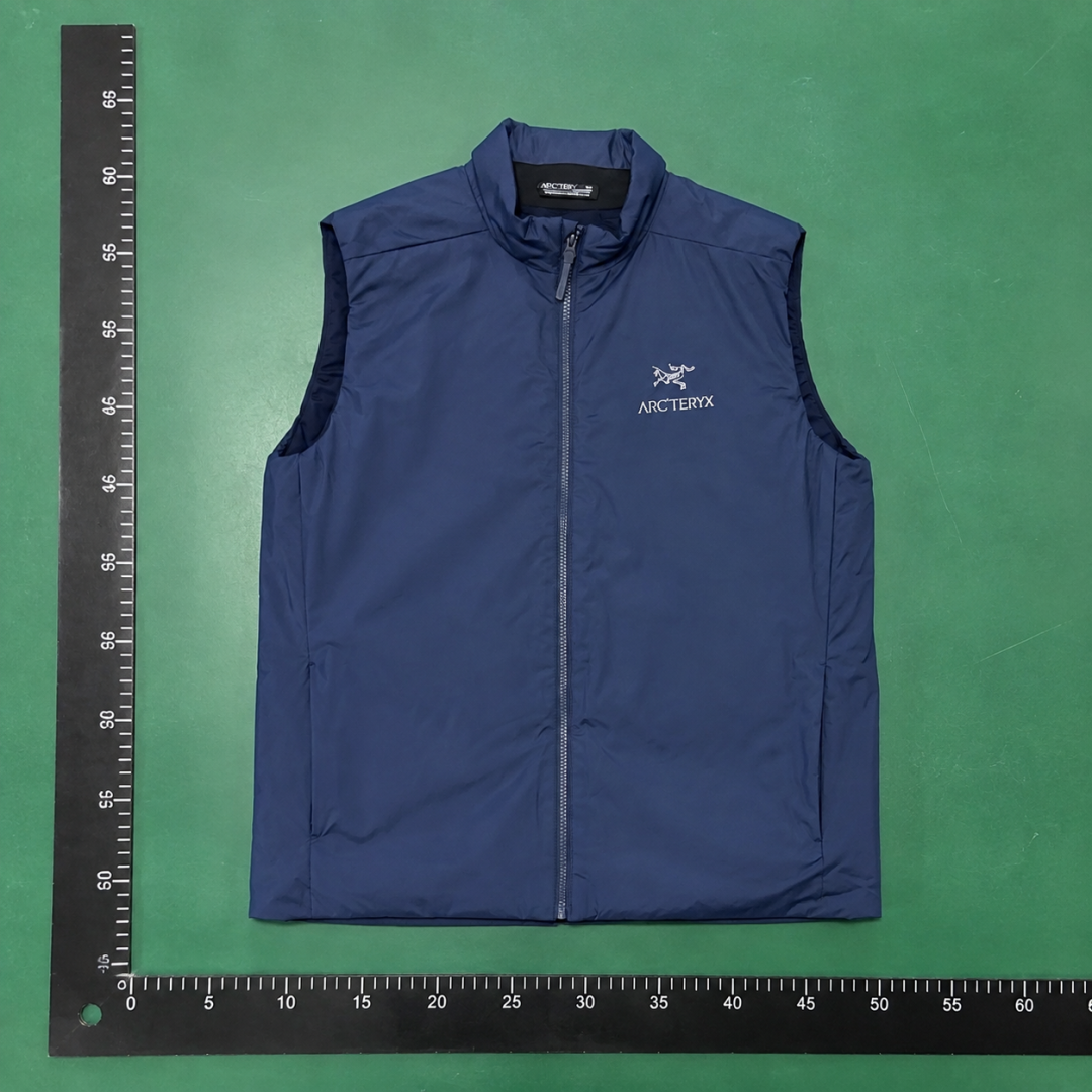 Arc'teryx Lightweight Shell Vest with simple stand collar in Navy QC photo
