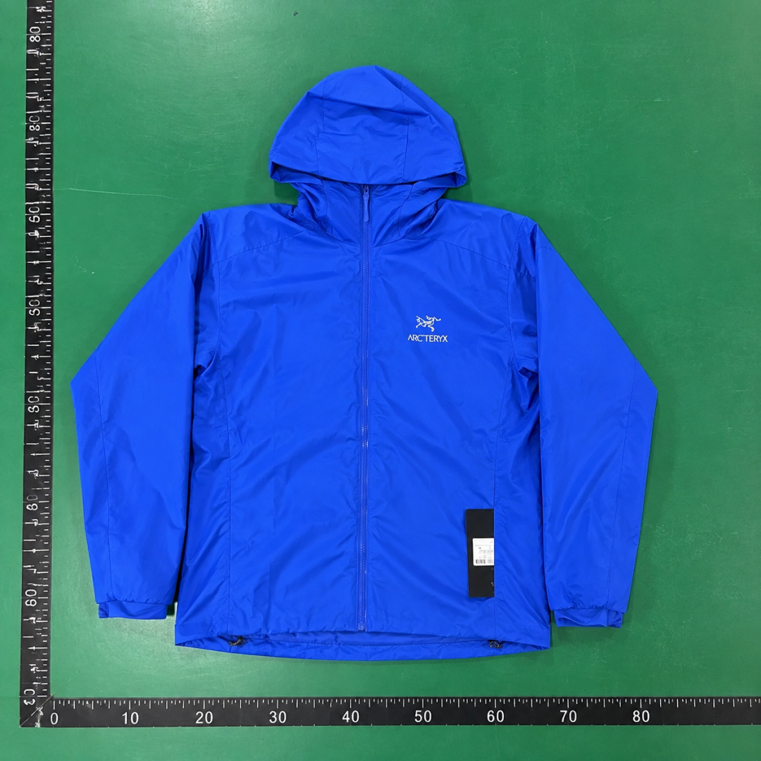 Arc'teryx Royal Blue Lightweight Shell Jacket with vivid hooded finish and compact outdoor profile QC photo
