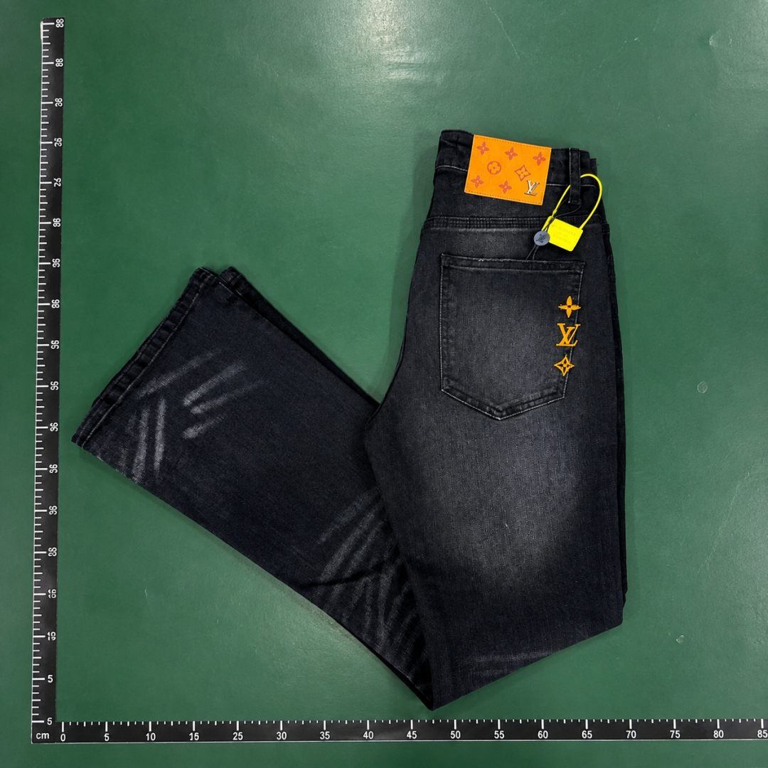 Graphic Jeans in Black with bold yellow marks and washed streetwear detailing - Evisu QC photo