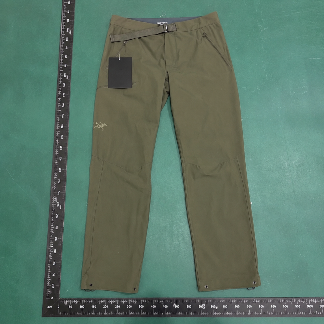 Arc'teryx Olive Technical Straight Pants with clean outdoor profile and subtle performance logo QC photo